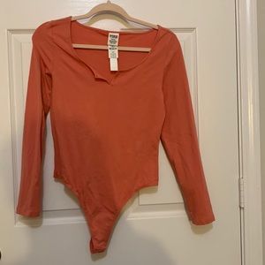 Victoria’s Secret PINK thong bodysuit. Peach color. Size Medium